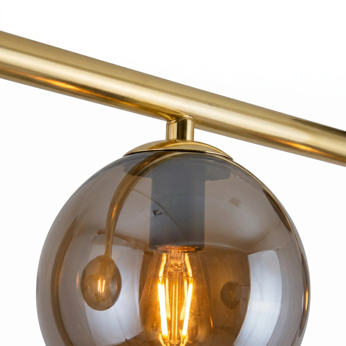 détail barre dorée globe verre graphite fumé