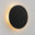 Applique murale ronde NIMBA en métal noir mat, halo doux allumé sur fond clair